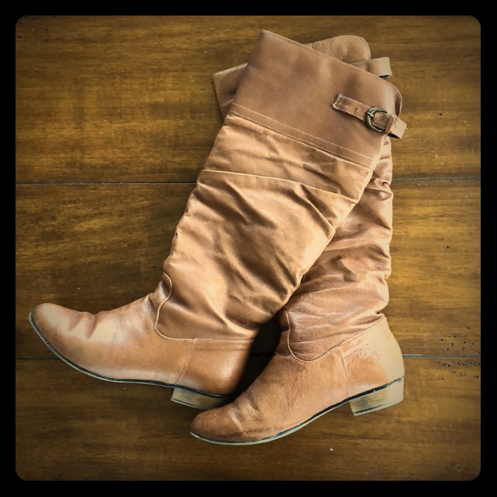 Tall brown boots.